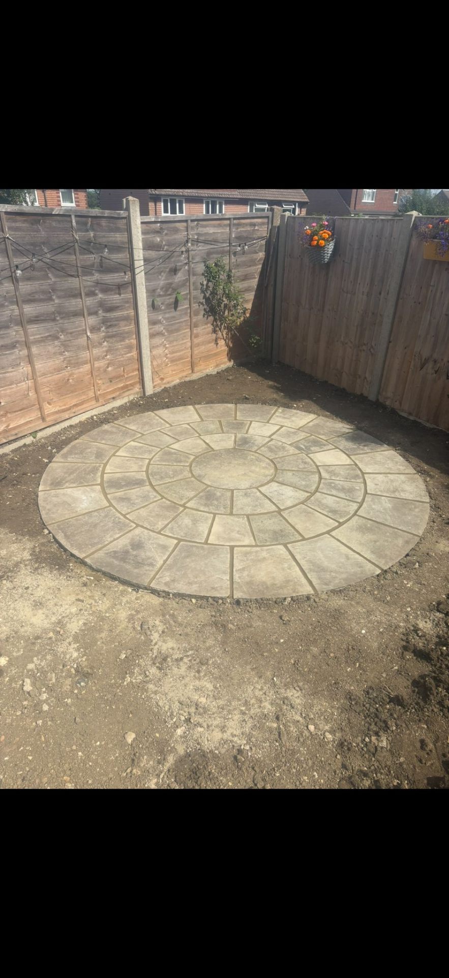 Circular paving feature in garden design by Burton Builds
